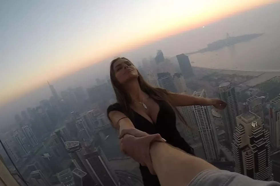 Model Hangs Off 1,000-Foot Skyscraper for Astonishing Shots