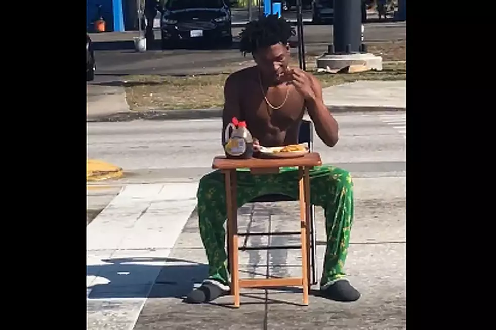 Shirtless Lunatic Devours Pancakes in the Middle of the Road