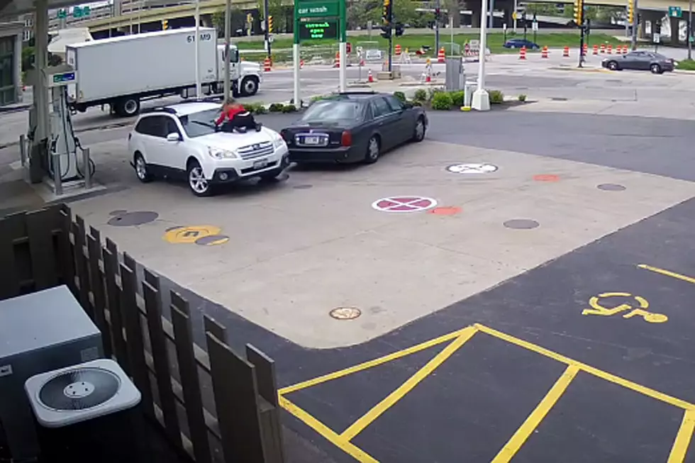 Fearless Woman Jumps on Car Hood to Stop Carjacker