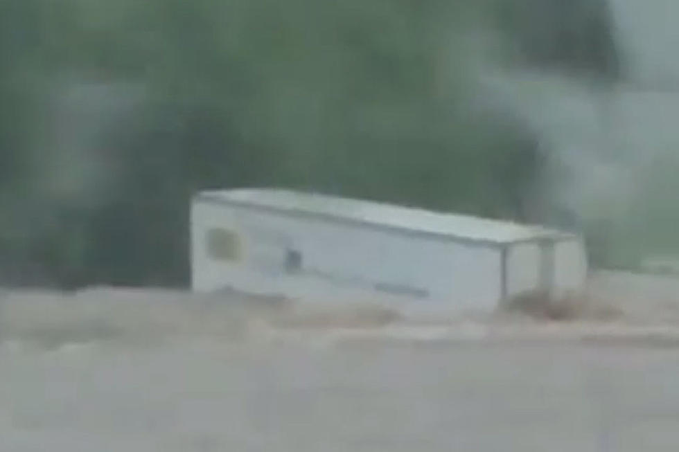 Intense Flooding Easily Carries Semi-Trailer Away
