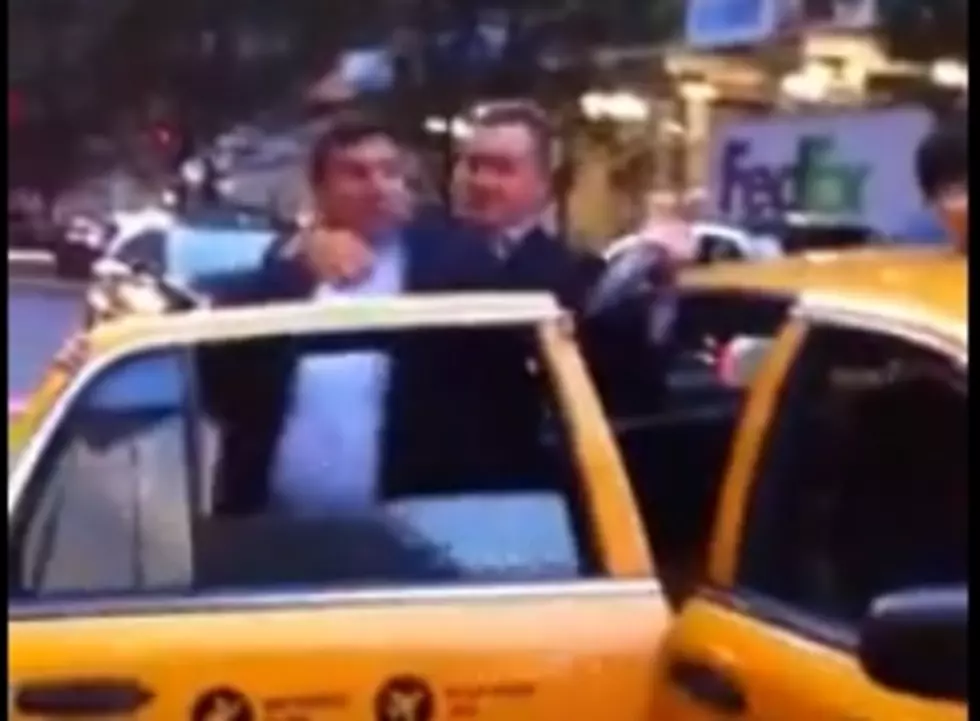 Two Businessmen Fighting Like Children Over A Taxi [Video]