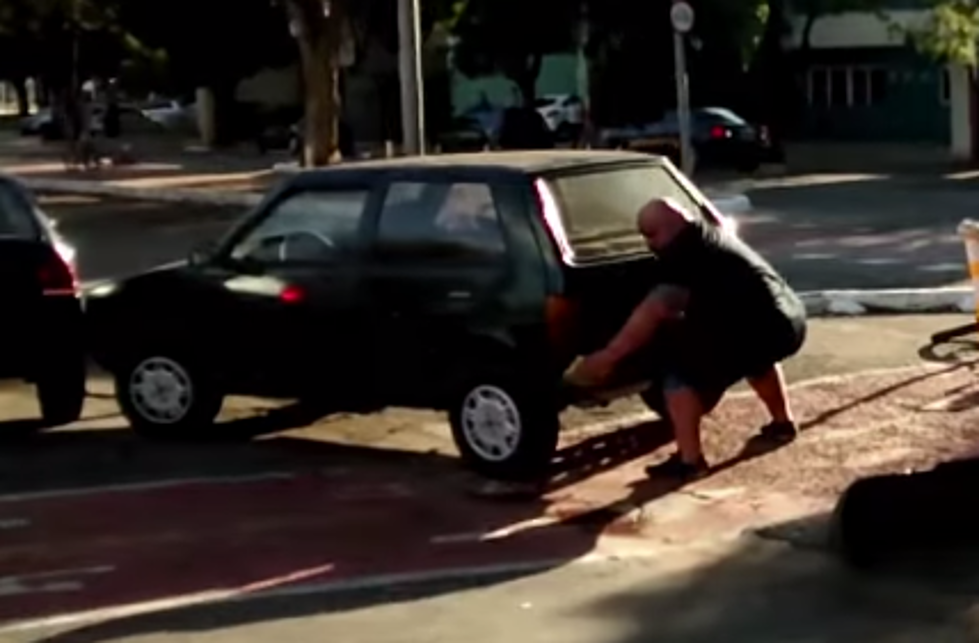 Buff Biker Lifts Car Out Of Bike Lane [Video]