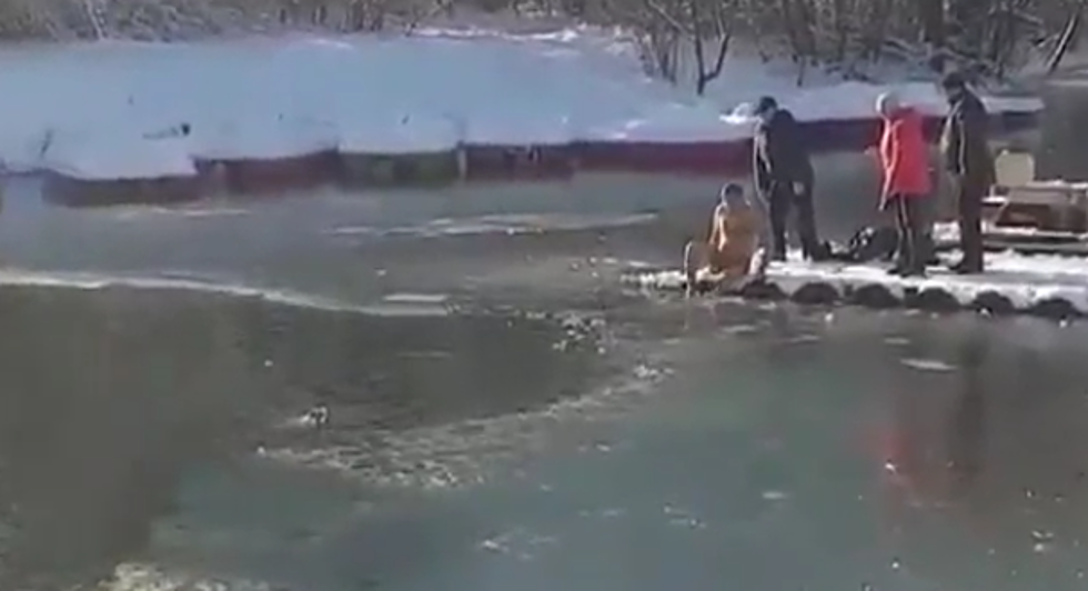 Man In Russia Jumps Into A Frozen Lake To Rescue His Dog [VIDEO]