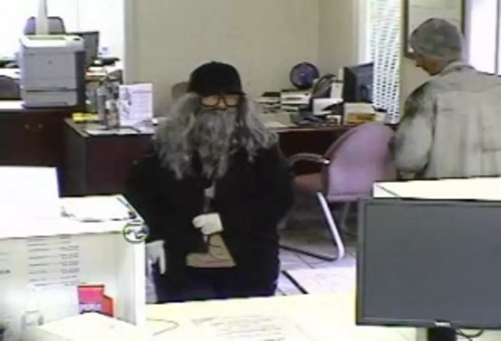 Disguised Woman Robs Kinder Bank