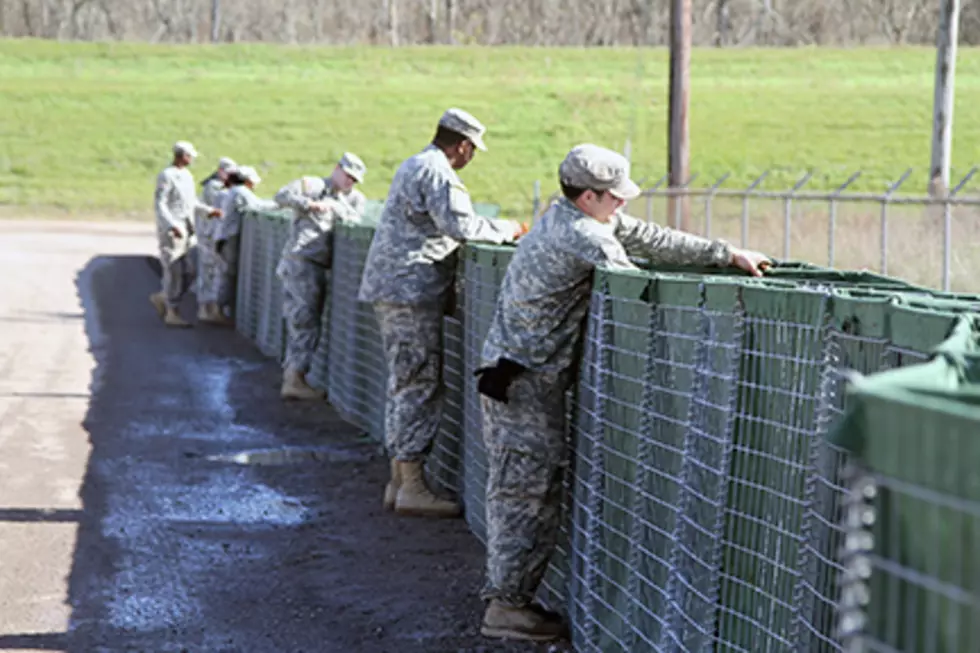 National Guard Erecting Protective Barriers Against Flood