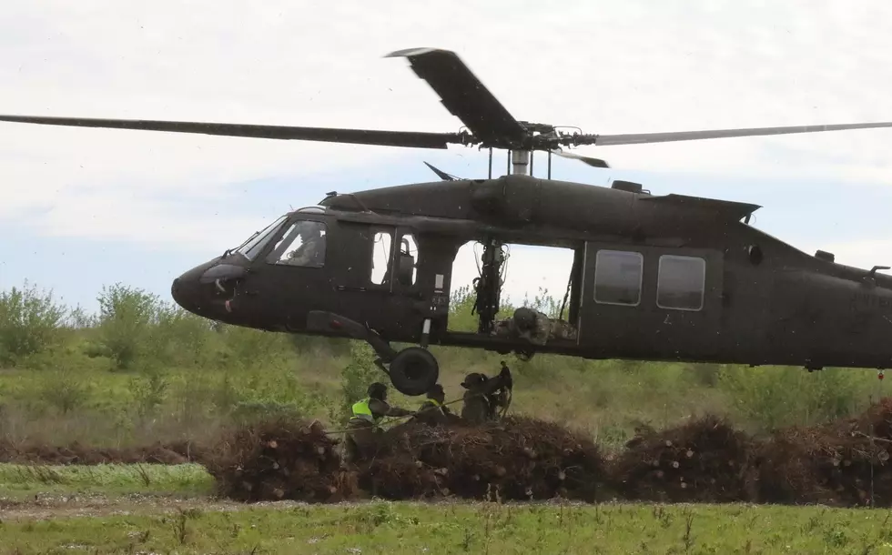 Black Hawk Helicopters Drop Christmas Trees into Louisiana Marshe