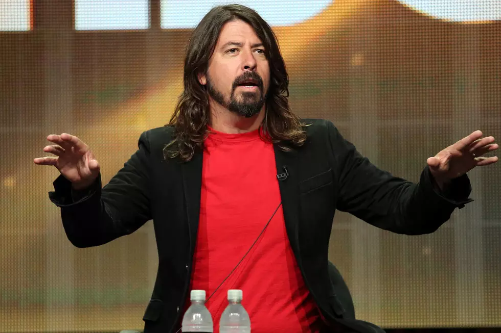 Foo Fighters’ Dave Grohl Suffers From Food Poisoning, Chugs Beer Anyway [Video]