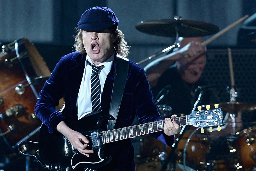 AC/DC’s Angus Young on His Brother Malcolm, Playing With Axl Rose + Cliff Williams’ Retirement