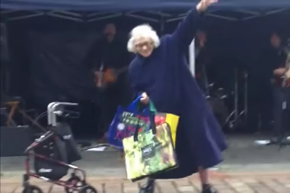 Elderly Woman Hears AC/DC Song, Stops to Dance + Wows Crowd