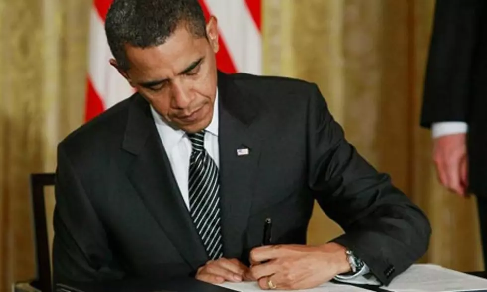 Obama Signs Bill Averting Government Default