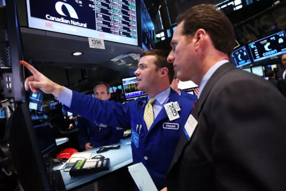 Stocks Edge Higher as Investors Consider Deal News