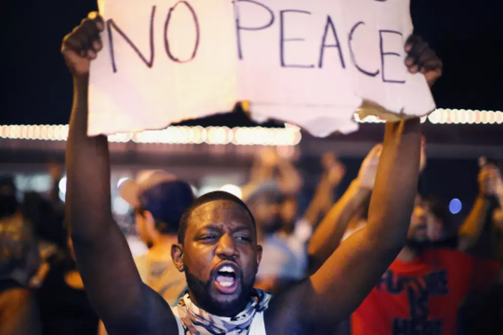 Streets of Ferguson stay calm after violent nights