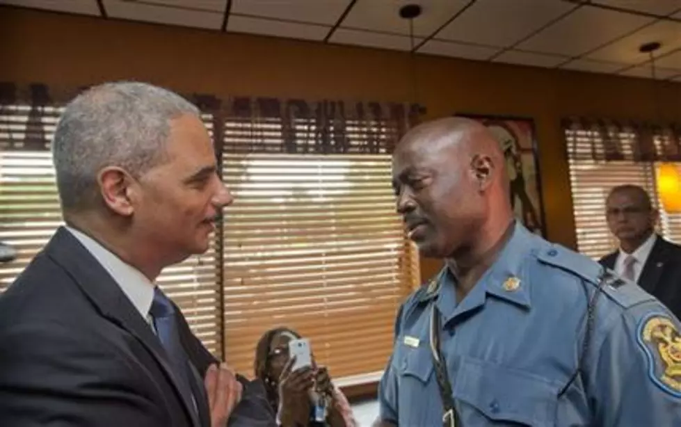 Holder offers reassurance to people of Ferguson