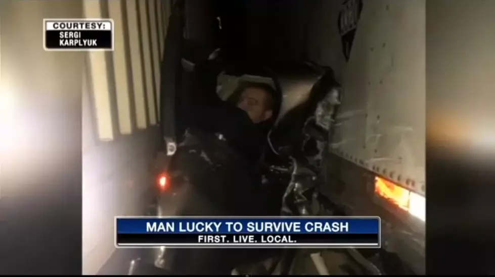 WATCH: Man lucky to be alive after being pinned between 2 tractor trailers
