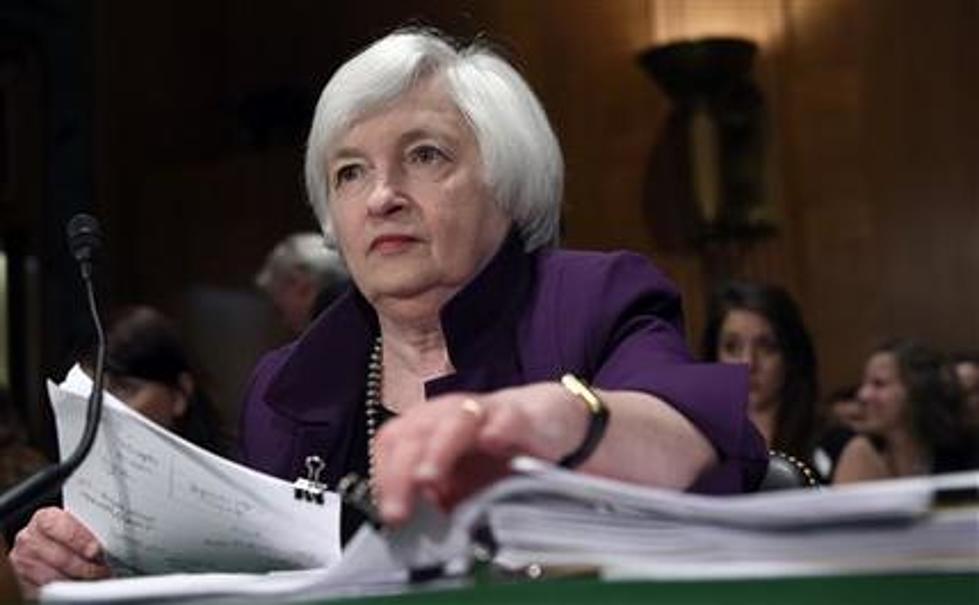 Fed holds steady on rates, seeks further economic gains