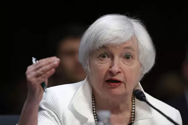 Fed keeps key interest rate steady but sees fewer risks