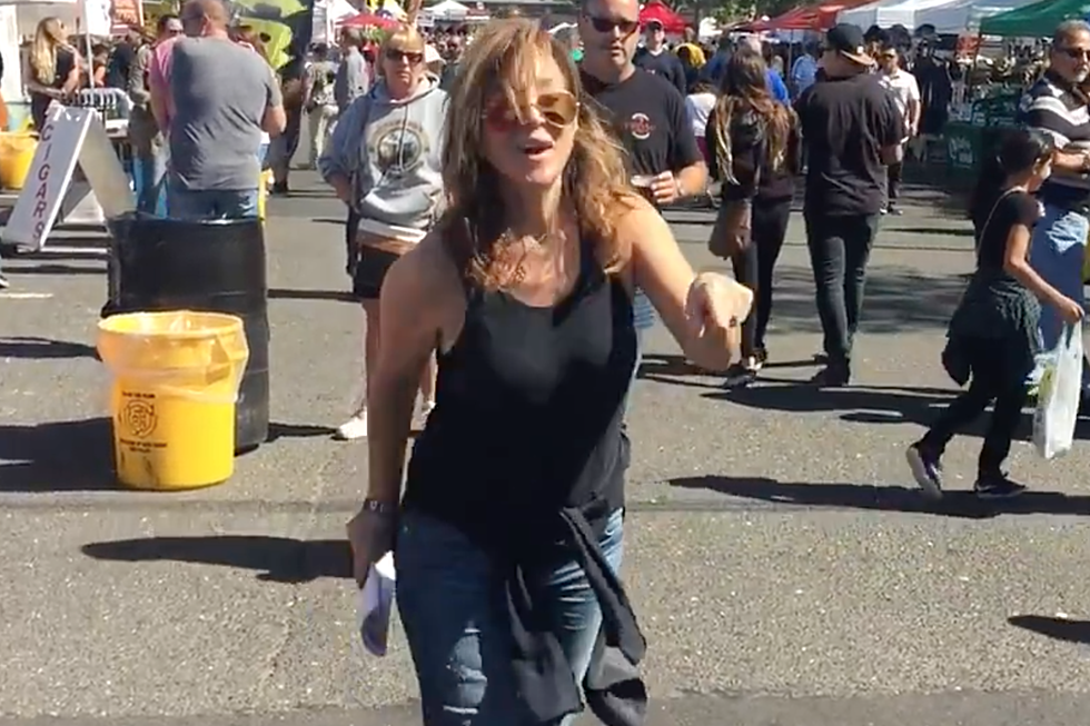 Judi Franco dances in the street at the Red Bank Oyster Festival