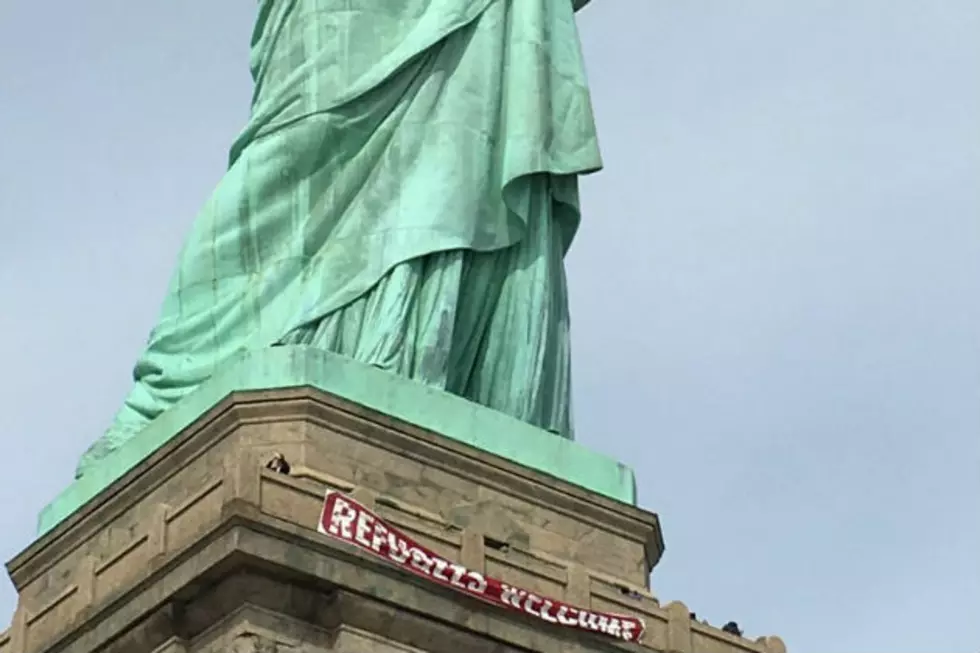 ‘Refugees Welcome’ banner unfurled at Statue of Liberty