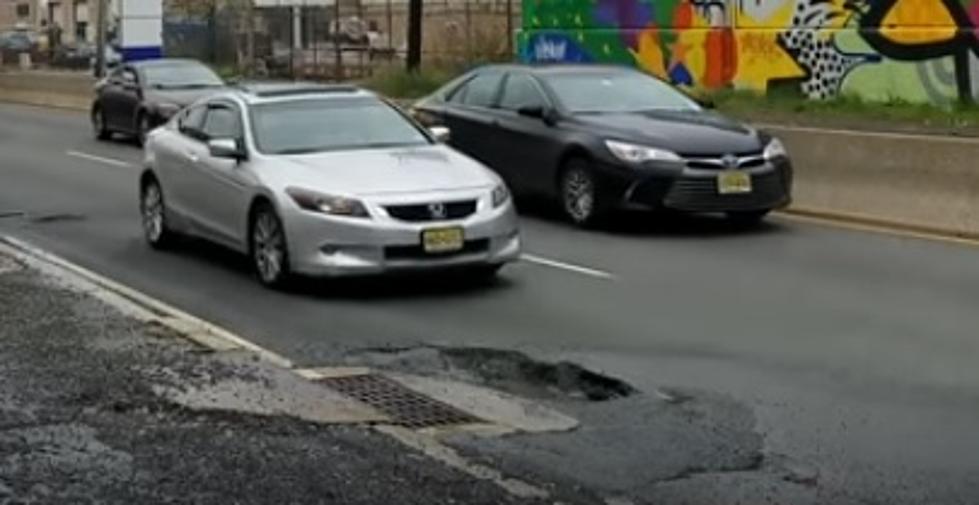 I can&#8217;t stop watching this video of cars bottoming out hitting a Jersey City pothole