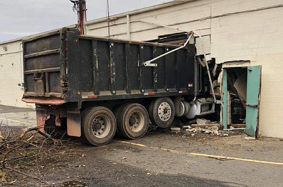 Truck smashes through Freehold shopping center wall