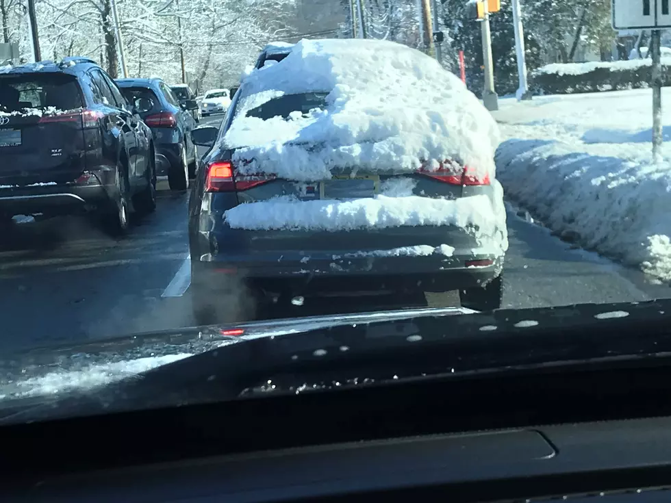 This guy is why we have a law about clearing snow off cars