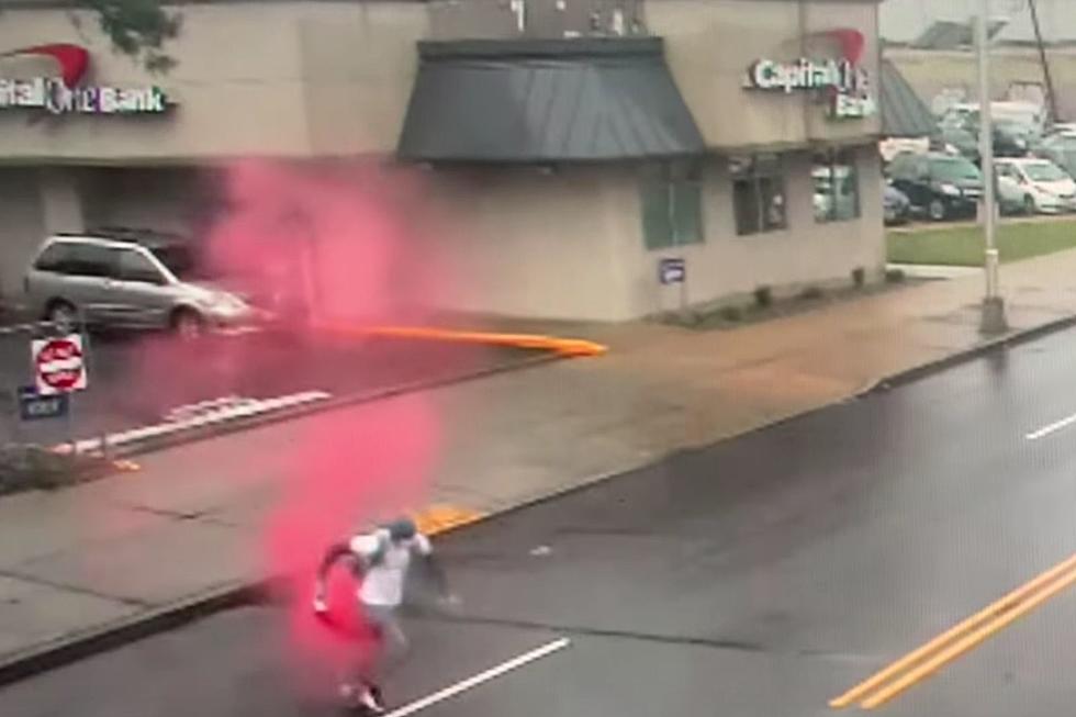 Newark police share video of bank robber as dye pack explodes