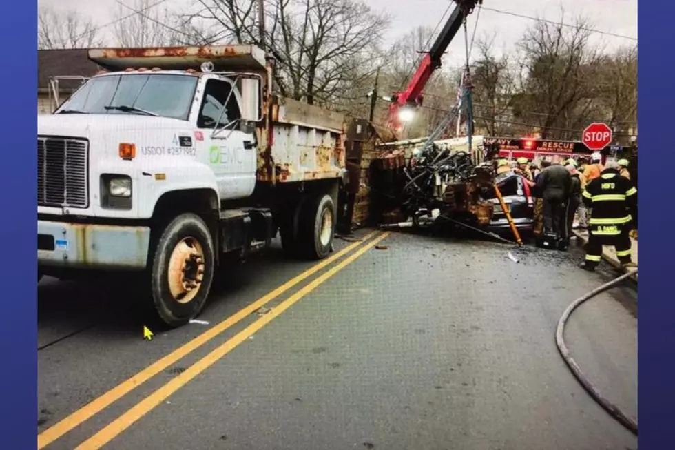 NJ woman injured: Machinery falling from truck crushes her car