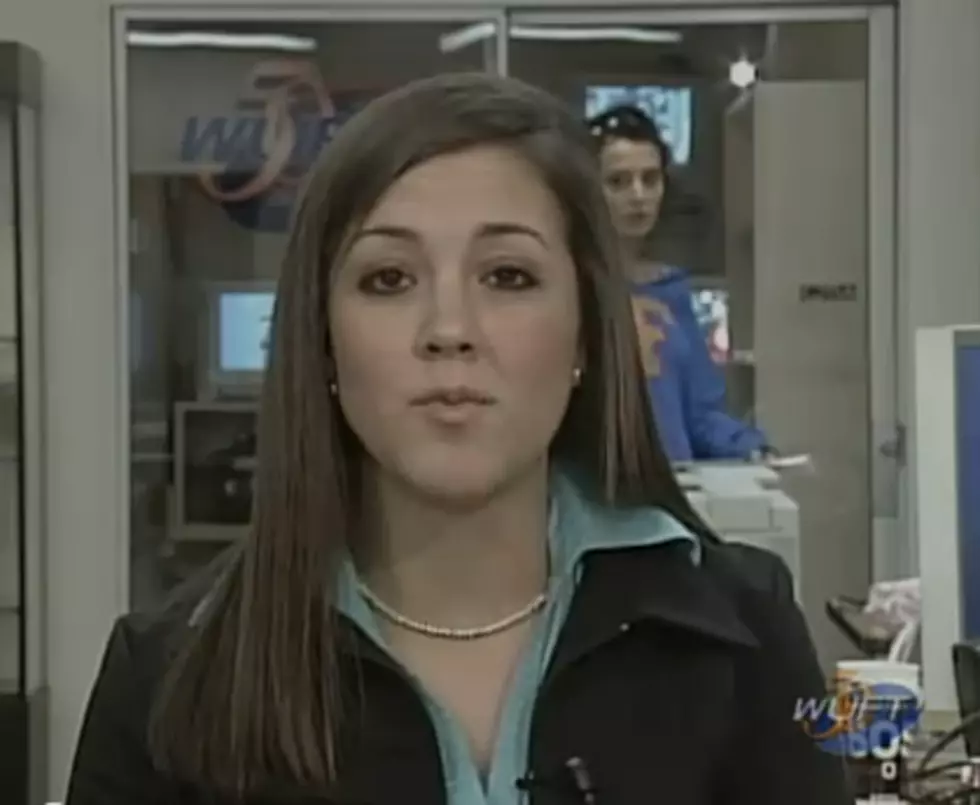 Woman Realizes She is in the Background of a News Story