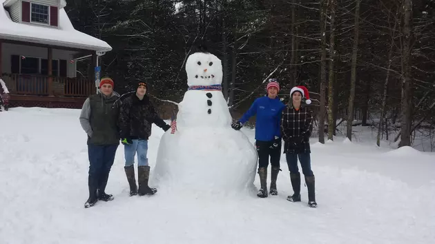 Teens Spend Snow Day Building 10 Foot Snowman in Cold Brook