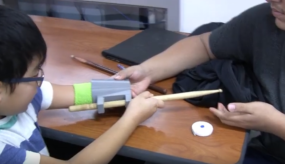 Student Builds Prosthetic for Boy to Play Drums with Both Han