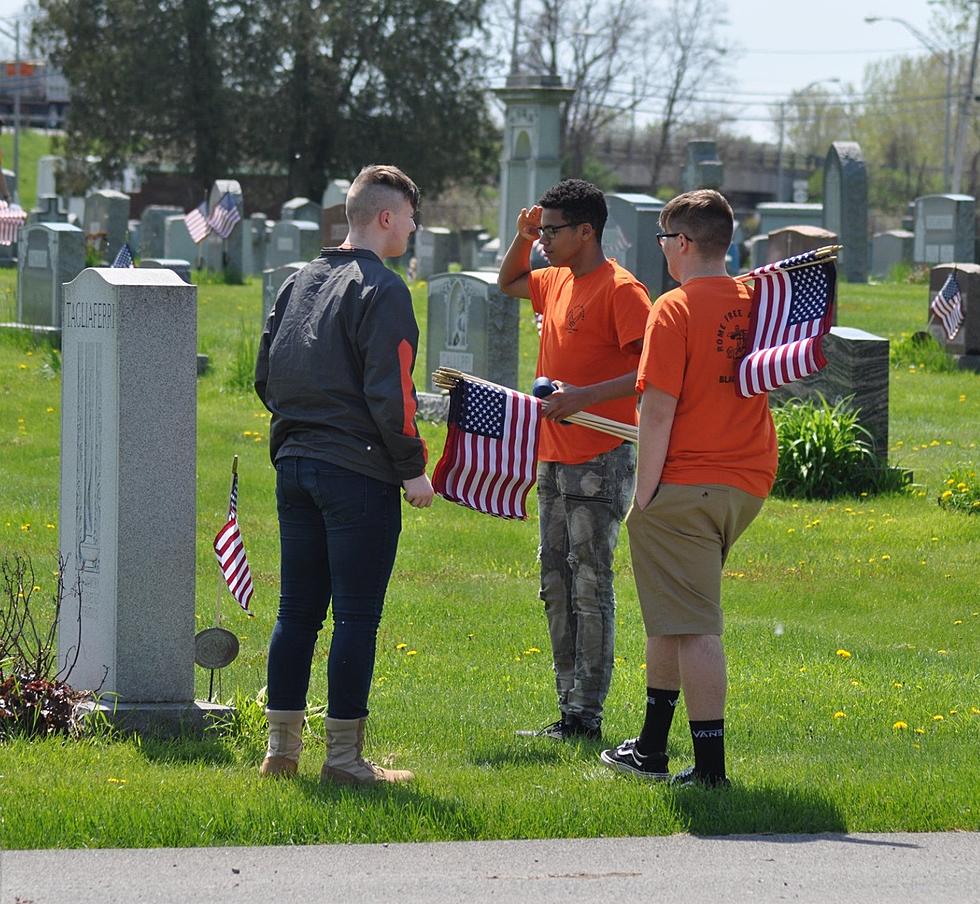 Rome Students Honors Veterans by Placing Flags on Gravestones