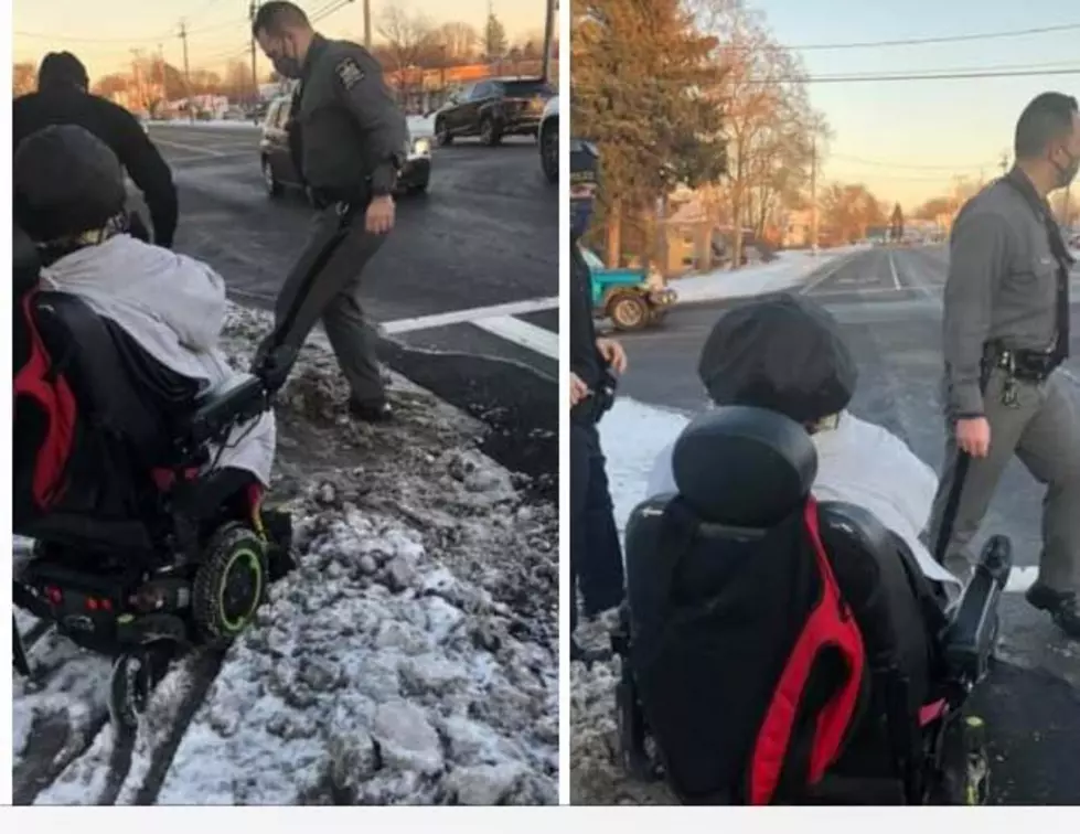 Two New York Police Officers Help Woman in Wheelchair Stuck in Snow