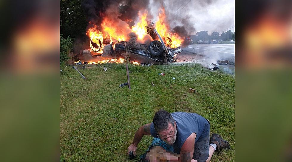 Hero Captured Rescuing Elderly Man From Burning Car in Epic Photo Identified