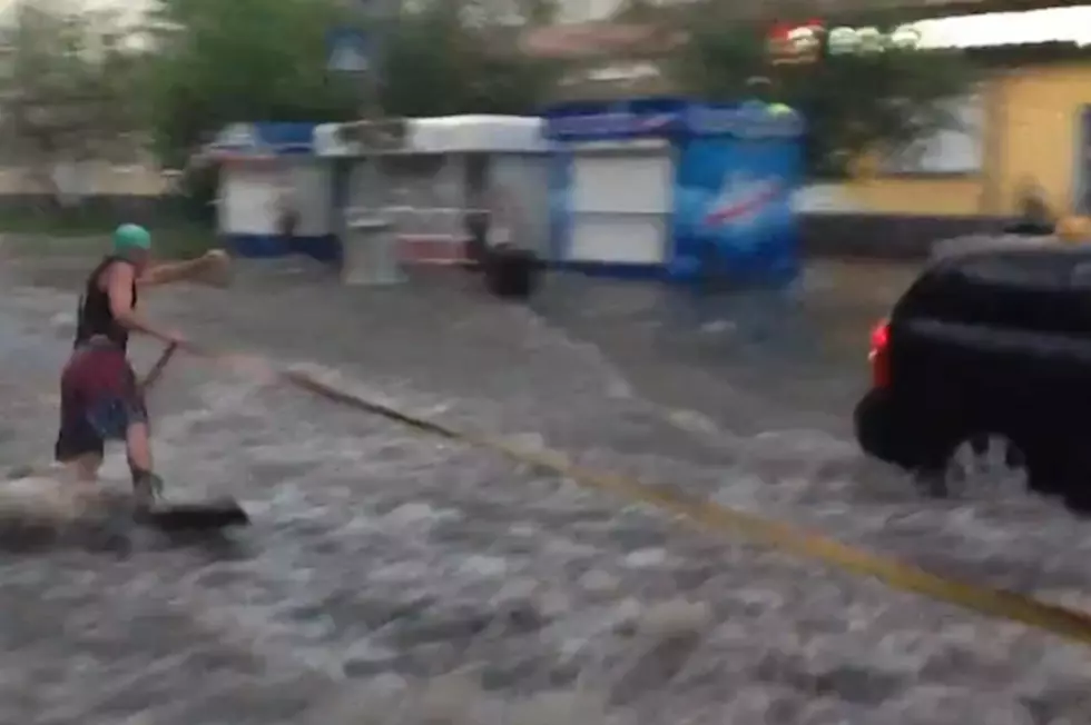 Russian Man Surfs Flooded Streets