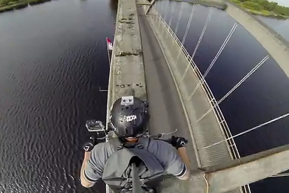 Daredevil Motorcyclist Crosses Bridge in Ridiculous Way, Lives to Tell About It