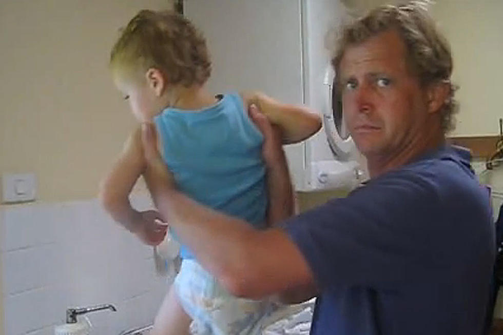 Repulsed Uncle Can Barely Hold Back the Vomit While Changing Diaper