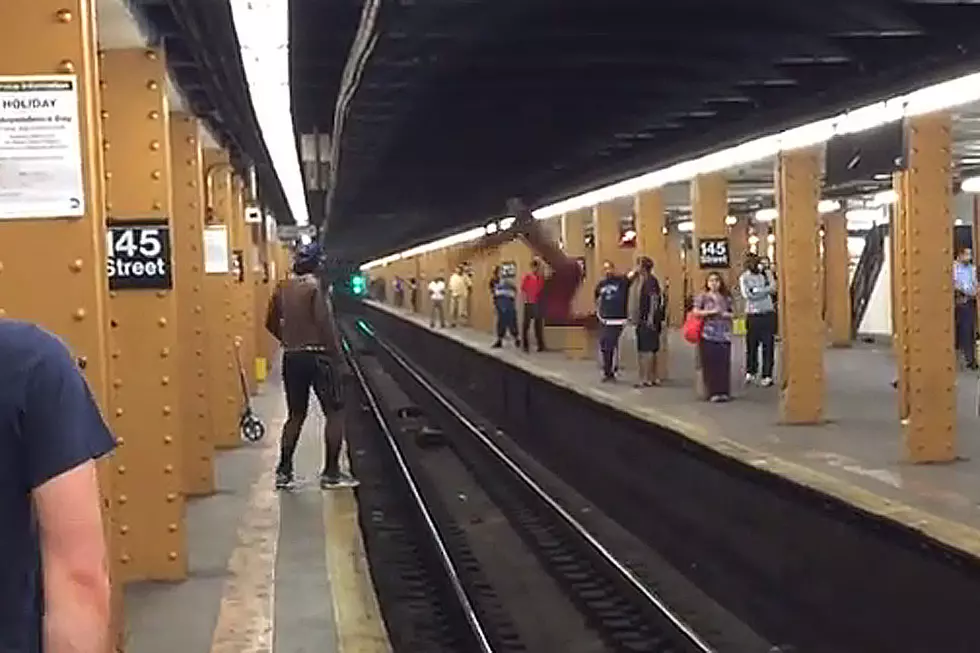Buffoon Trying to Jump Subway Tracks Remains a Buffoon