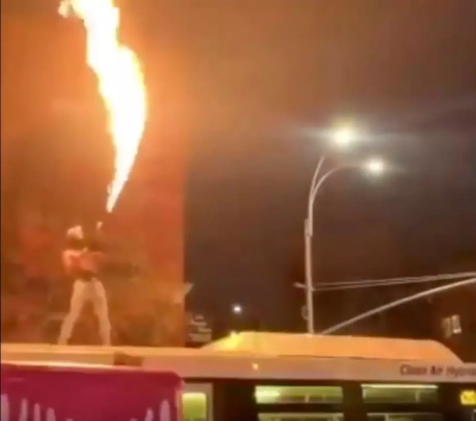Just a Video of a Guy Standing on a NYC Bus Shooting a Flamethrower