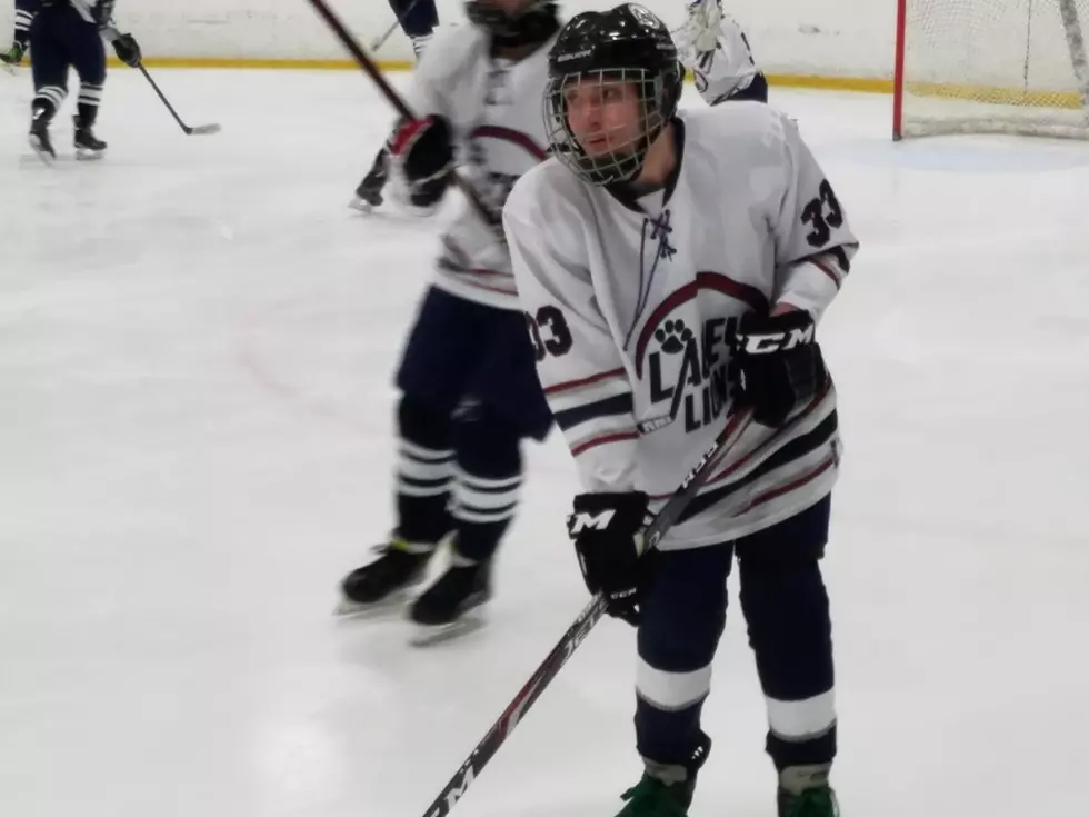Hockey player with cerebral palsy suits up for Lacey varsity team