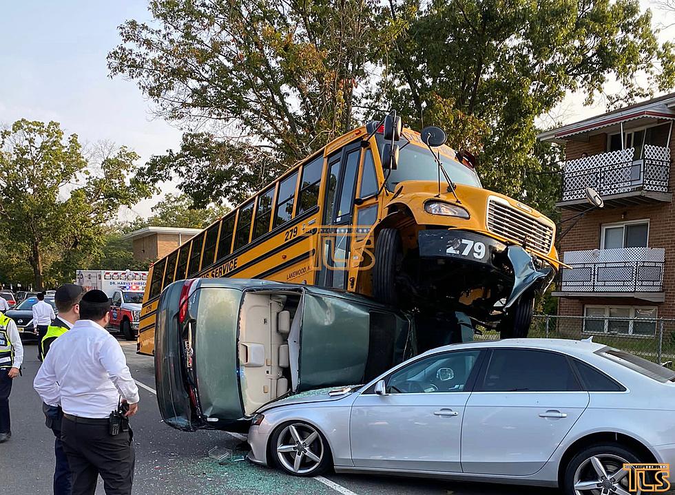 Stunning crash as school bus ends up on top of car in Lakewood