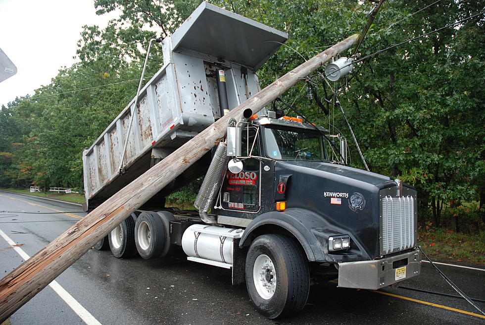 Driver unharmed after dump truck crashes into pole in Manchester