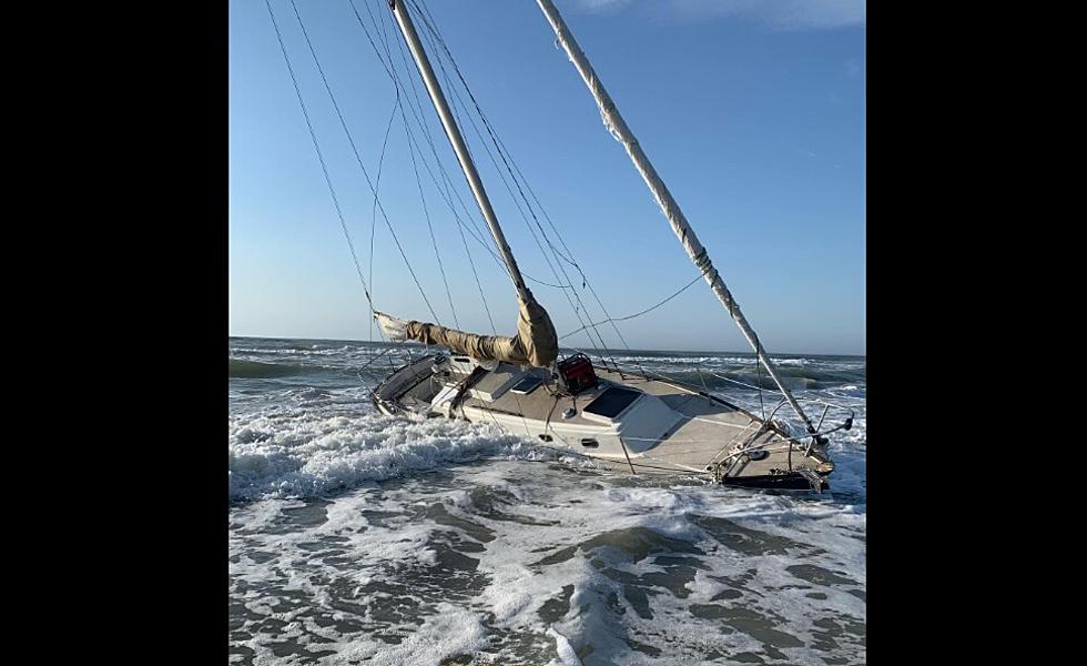 Sailboat Washed Up on Avalon Beach While Sailor Slept