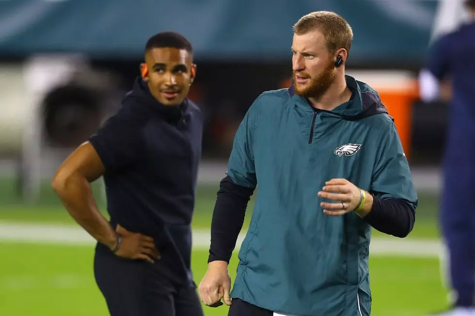 Eagles Head Coach Touching Base with Players on Roster