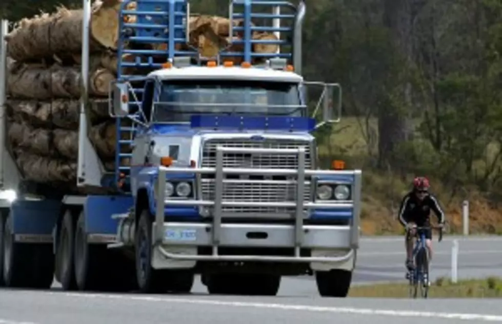 Logging Truck Overturns Killing 2, Injuring 19