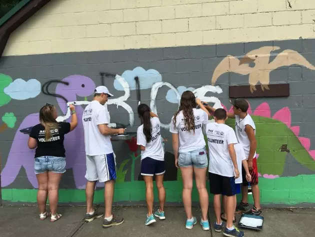 Graffiti Busters Touch Up Mural At Quinn Park In Utica