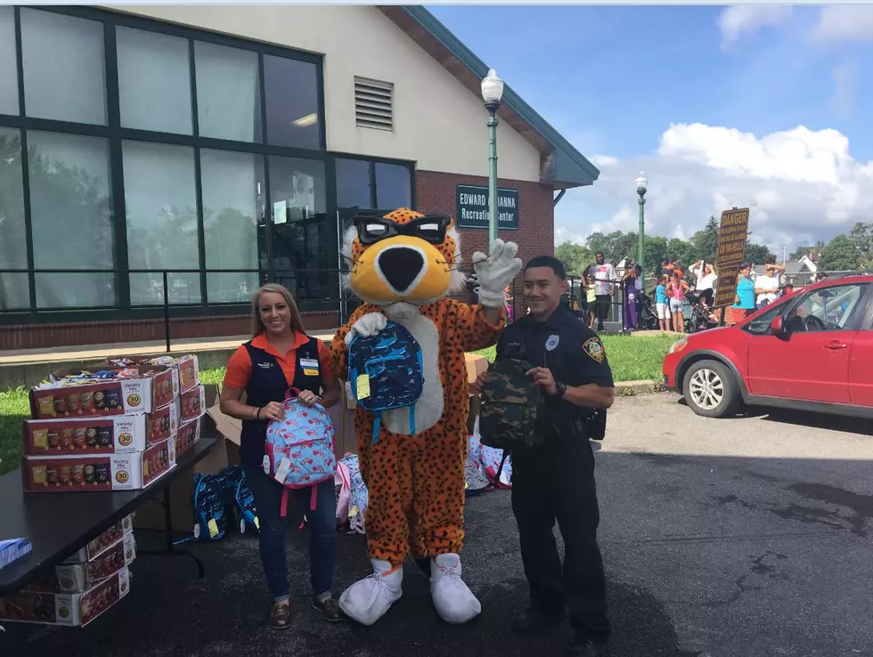 Utica Police And Walmart Team Up For Backpack Giveaway