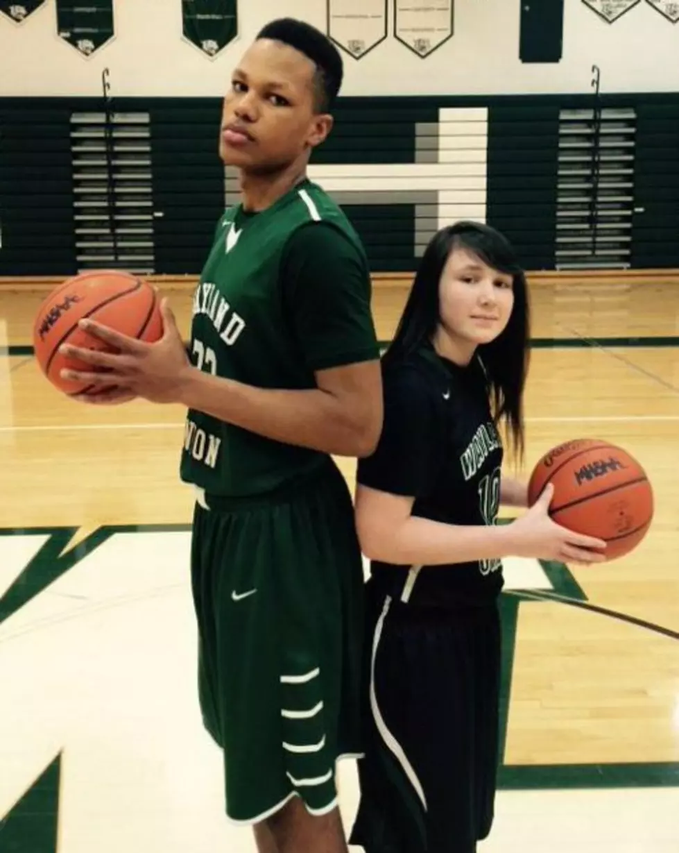 Wayland Union girls' basketball player Presley Hudson lines up next to Wildcats' boys' basketball standout Lacey James. Both are NCAA Division I bound next fall, with Hudson going to Central Michigan and James to Cleveland State. (Photo: Wayland Union High School)