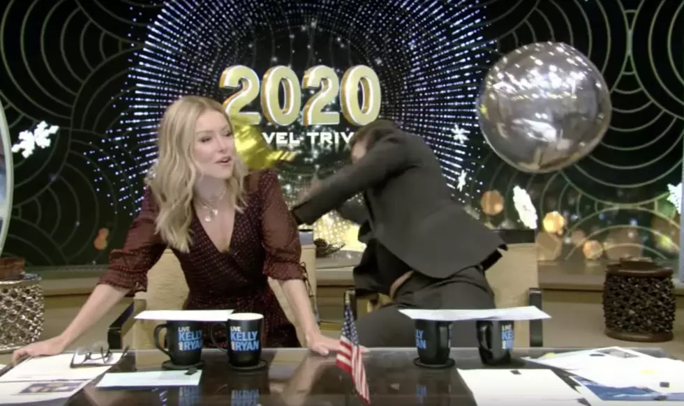 Ryan Seacrest Falls Out Of His Chair Trying To Catch A Balloon On Live TV