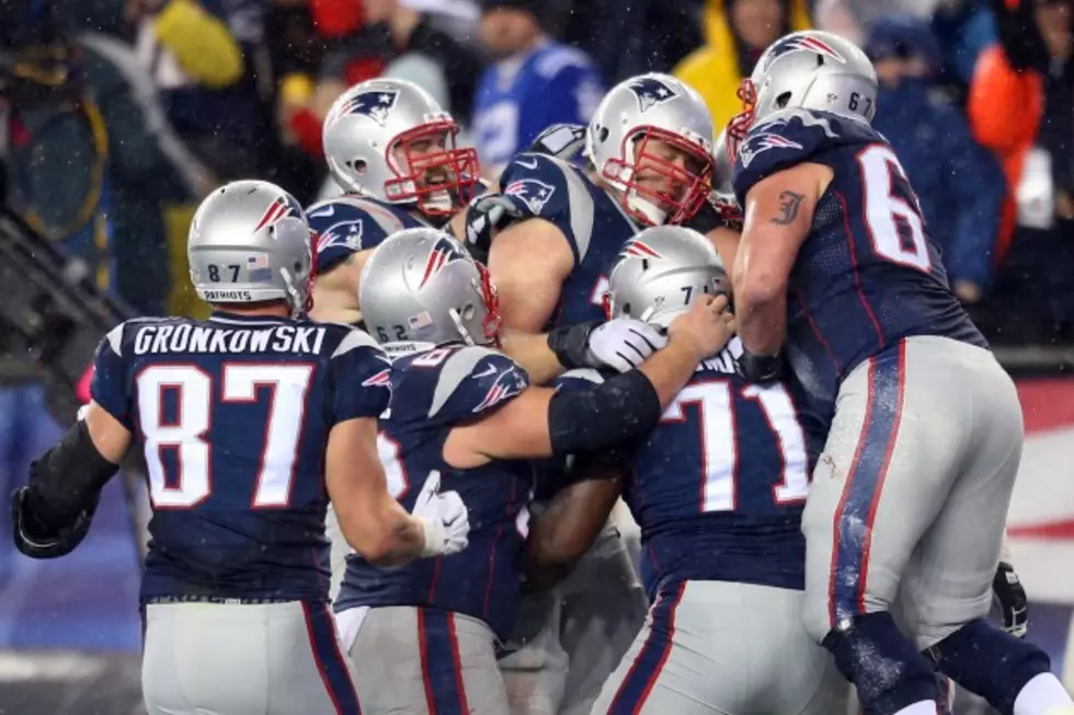 New England Inundates Indy, 45-7, in Soggy AFC Championship