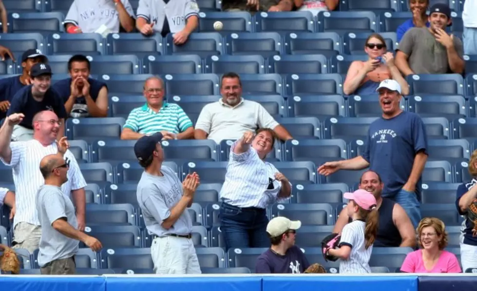 What an Arm! Yankees Fan Tosses Ball Back and Hits Player